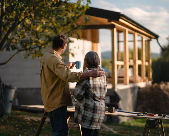 Couple in front of house