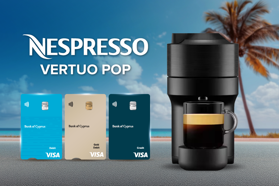 Nespresso machine with BoC cards in the backgroung