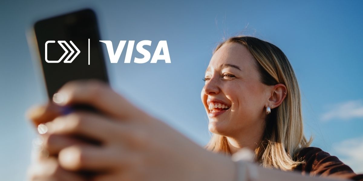 Woman holding phone - Visa click to pay