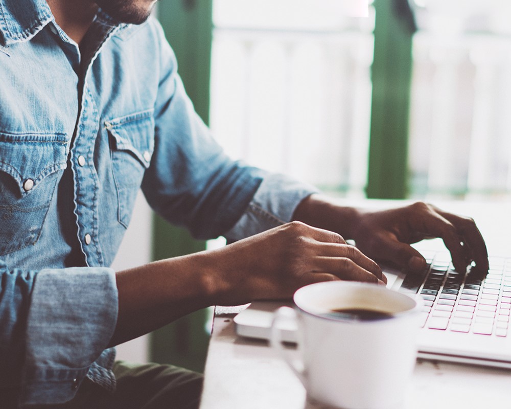 Person typing on laptop
